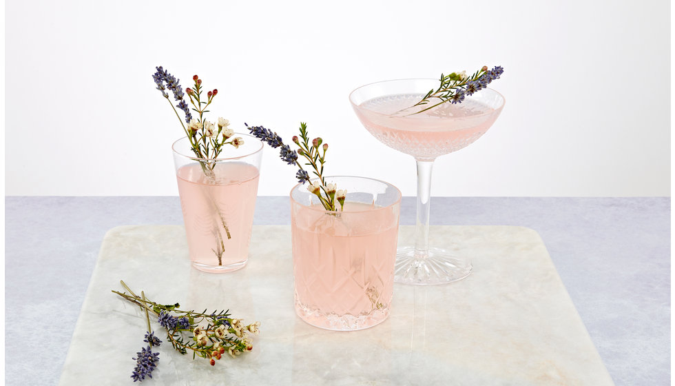 Three cocktails in three different glasses.