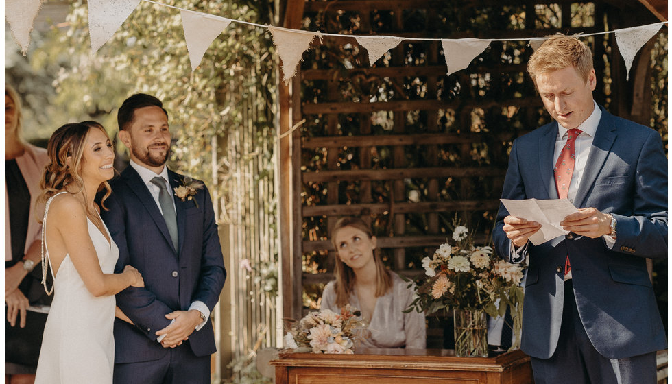 The wedding venue was decorated with bunting and flowers.