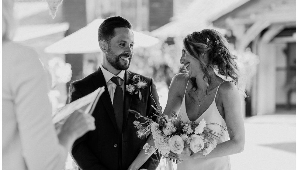 The bride and groom during their outdoor wedding ceremony.