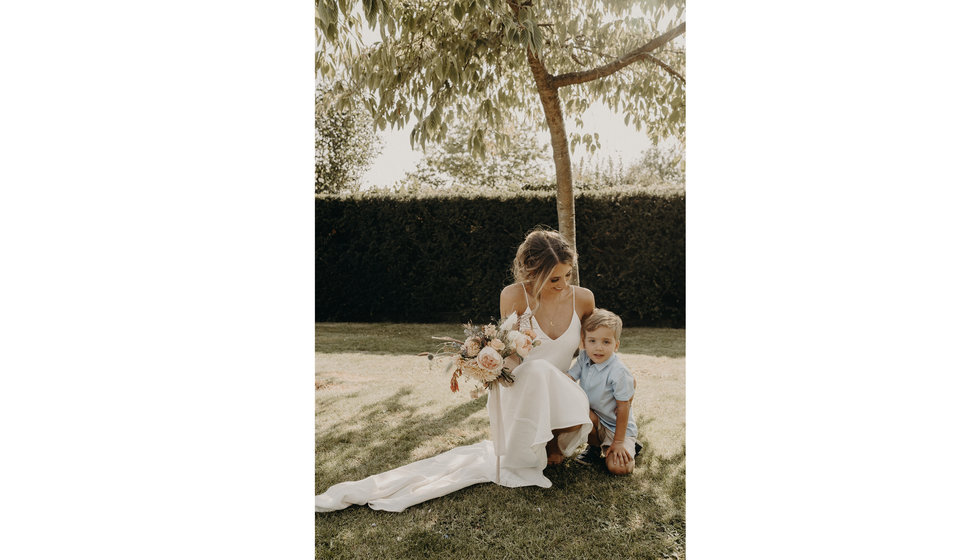 The bride hugging a family member on her wedding day.