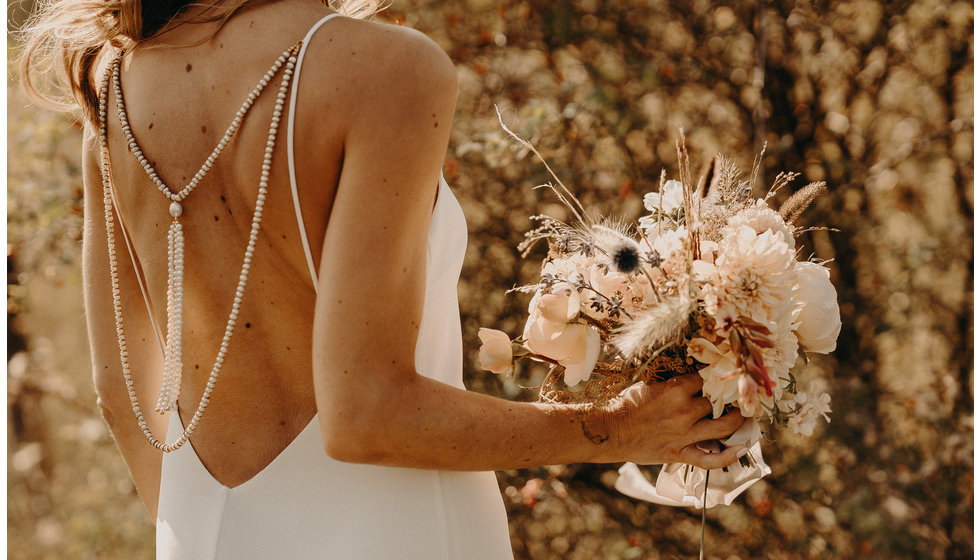 The bride wore a simple dress from Grace Loves Lace.