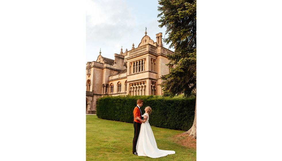 The bride and groom outside their wedding venue.