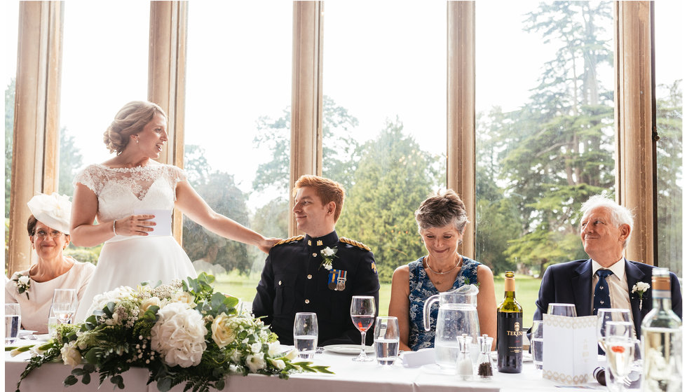 The bride doing a speech at her wedding.