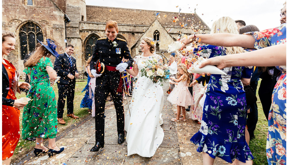 The bride and groom leave the Church after their wedding.