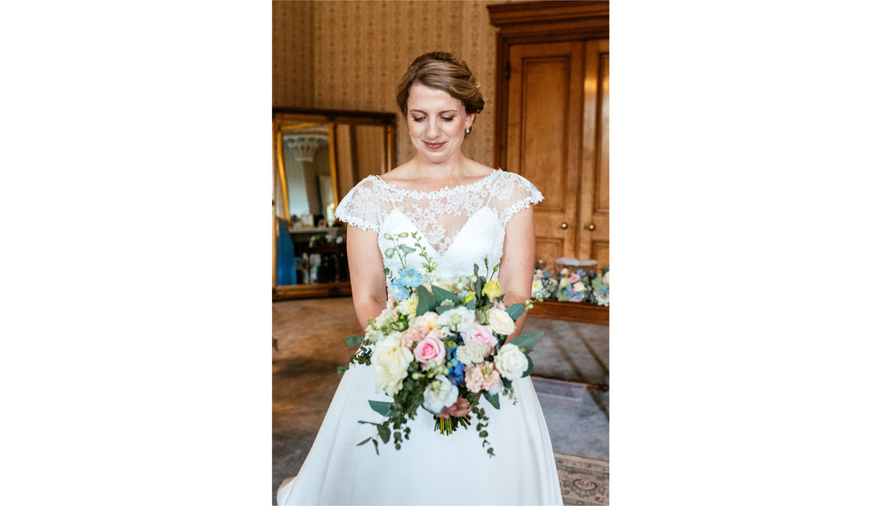 The bride carrying her bouquet. 