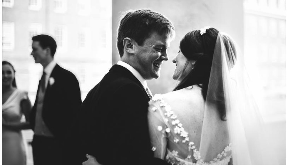 The bride and groom share a moment outside the Royal Hospital Chelsea after their Church Wedding.