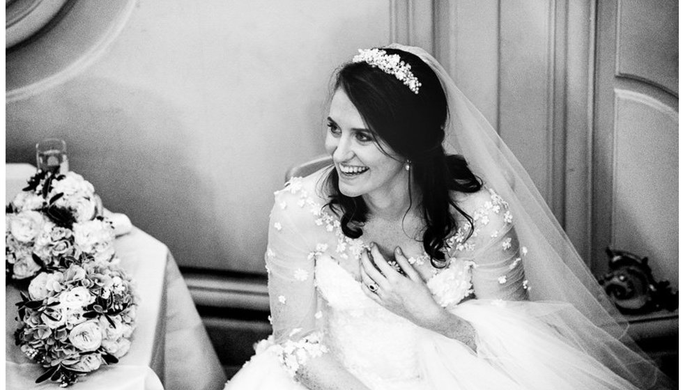 The bride smiling on her wedding day. 