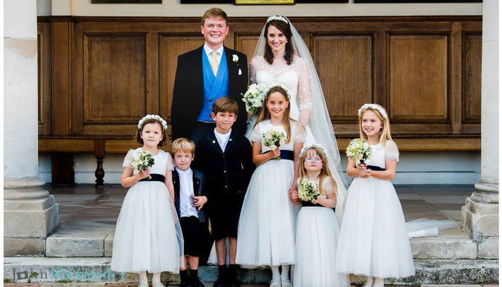 Will and Lexie outside the Royal Hospital in Chelsea with their flower girls and page boys.