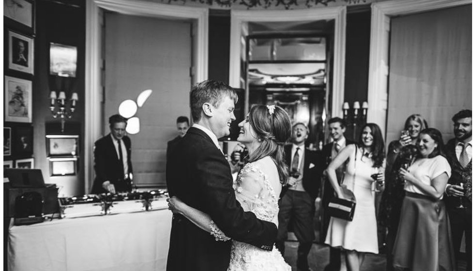 The bride and groom doing their first dance on the dance floor in the Savile Club.