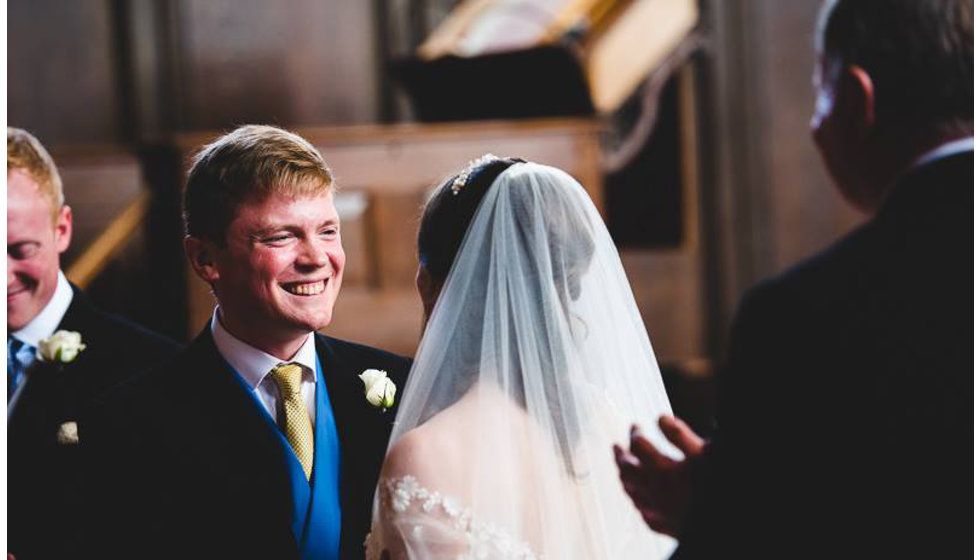 The bride and groom doing their vows in the Church. 