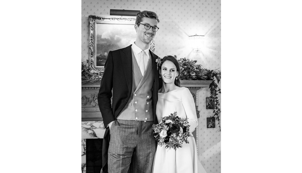 The bride and groom by the fire in Edwina's home after their intimate wedding. 