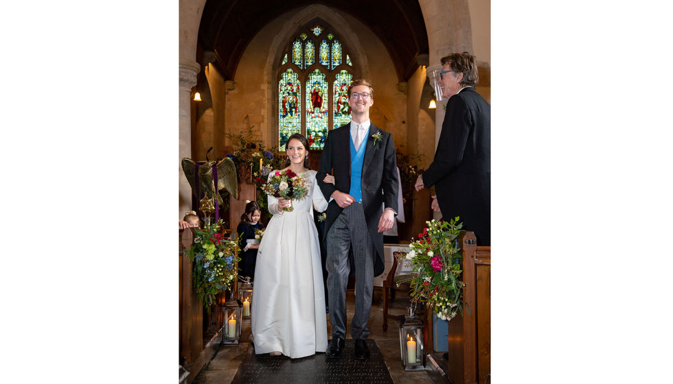 Edwina and Edward walking down the aisle in their Hampshire Church. 