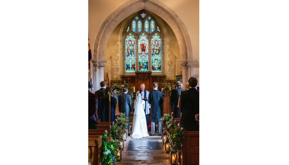 The bride and groom, in the Church getting married.