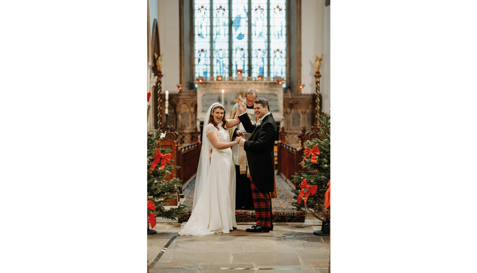 Sarah and Fergus celebrate as they are officially pronounced husband and wife.