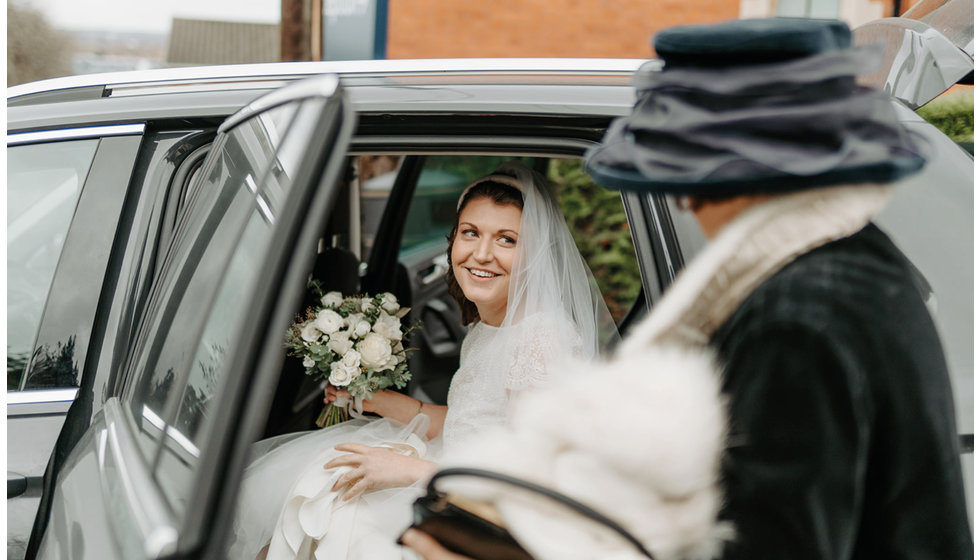 Sarah arriving at the Church in a car.