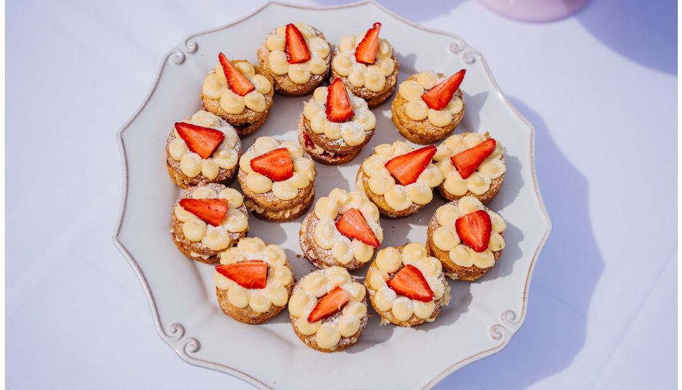 A plate of mini individual victoria sponges. 