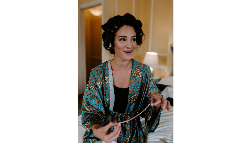 Sophie having her hair and make up done for her on her wedding day.