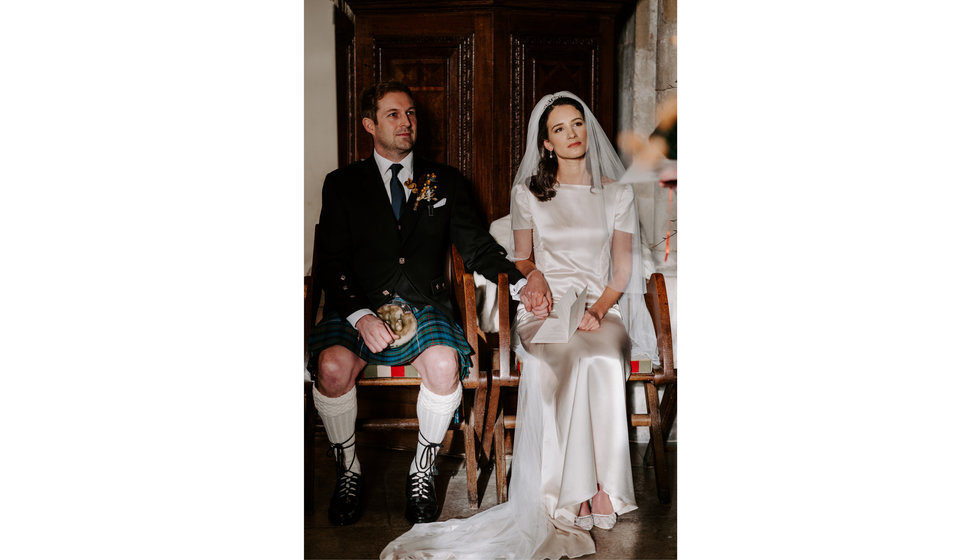 Sophie and Graeme sat in the Church holding hands during the ceremony.