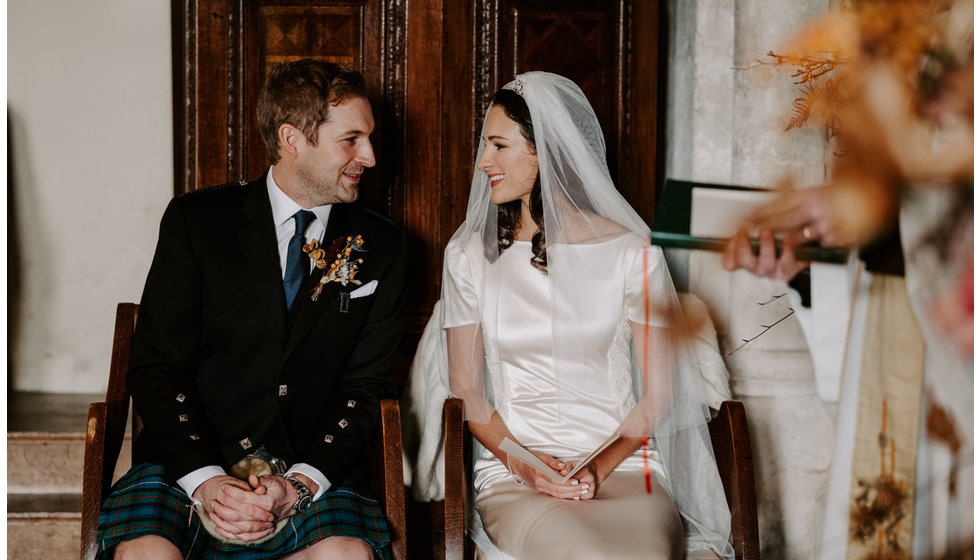 Sophie and Graeme look at each other during their intimate ceremony.