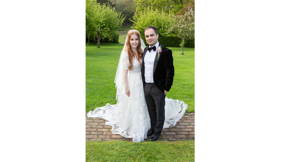 Sarah and Nico outside in the garden of their East Sussex Wedding. 