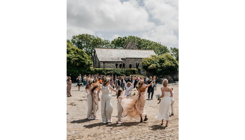 Chloe and Ed celebrate their wedding on Rock Beach, Cornwall