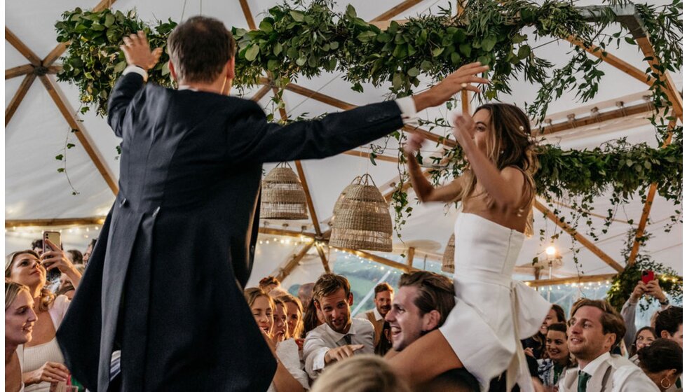 Chloe and Ed on the dancefloor, with Chloe's evening wedding look