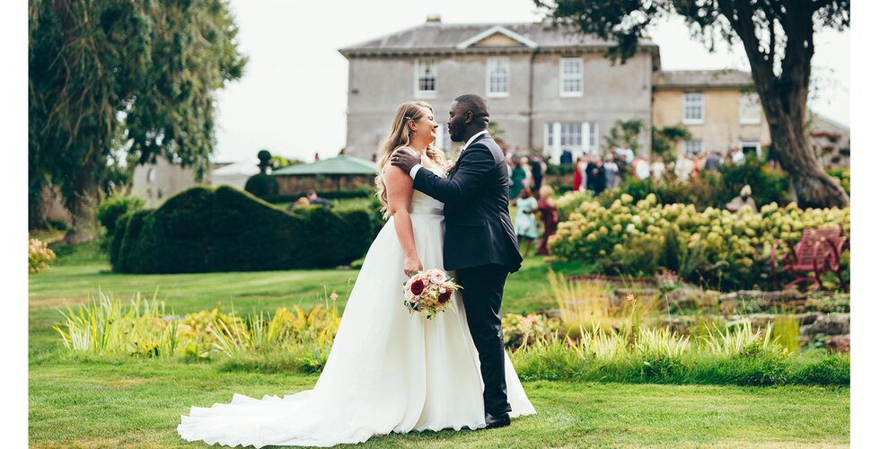 Bride and groom outside their Sussex manor wedding venue