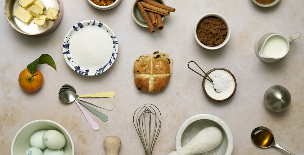 Baking ingredients to make hot cross buns all laid out.