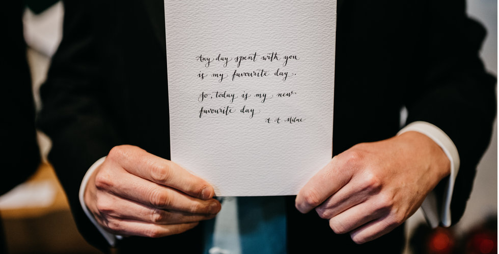 An usher holding the order of service with a lovely quote on the back.