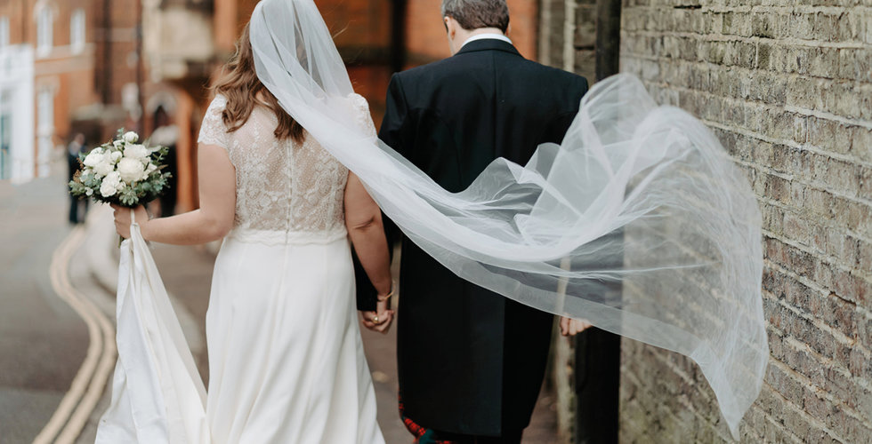 Fergus and Sarah leaving the Church after their intimate ceremony walking to their stretch tent reception in Sarah's mother's garden.