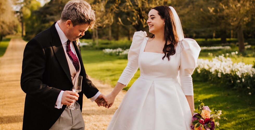 The Wedding Present Company | Bride and groom looking at each other during a spring flower-filled wedding in Lincolnshire